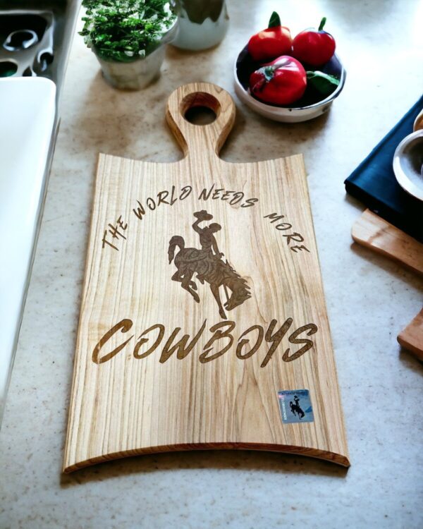 Shop Wyoming The World Needs More Cowboys Cutting Board