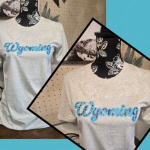 Shop Wyoming Wyoming Leopard Splash ~ Heather Oatmeal Bella Tee