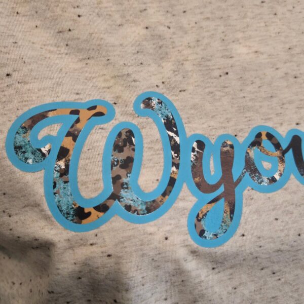 Shop Wyoming Wyoming Leopard Splash ~ Heather Oatmeal Bella Tee