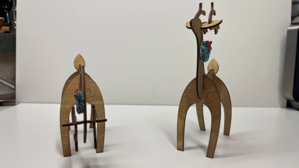 Shop Wyoming Wood Reindeer Decor – Standing & Grazing Reindeer with Wreath – Rustic Christmas Decoration