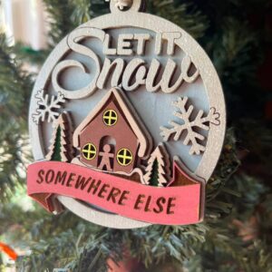 Shop Wyoming “Let It Snow Somewhere Else” Ornament – 3.5″ Round Layered Wood Funny Winter Tree Decor with Cottage & Snowflakes
