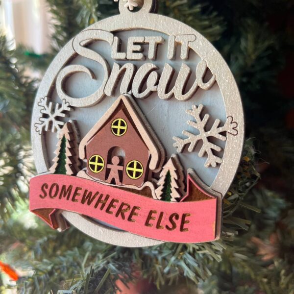 Shop Wyoming “Let It Snow Somewhere Else” Ornament – 3.5″ Round Layered Wood Funny Winter Tree Decor with Cottage & Snowflakes