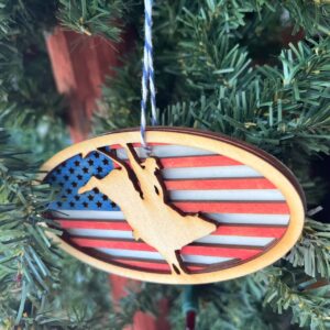 Shop Wyoming Patriotic Bull Rider Ornament – 4″ Oval Wood Rodeo Christmas Ornament with American Flag Background for Cowboy & Western Decor