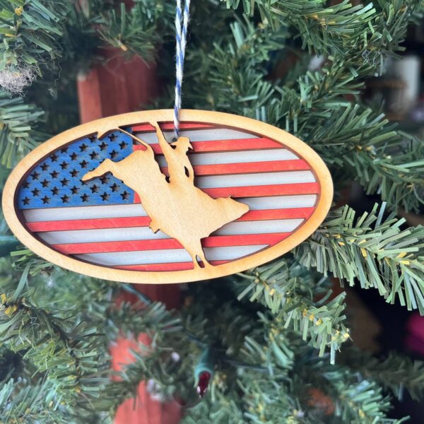 Shop Wyoming Patriotic Bull Rider Ornament – 4″ Oval Wood Rodeo Christmas Ornament with American Flag Background for Cowboy & Western Decor