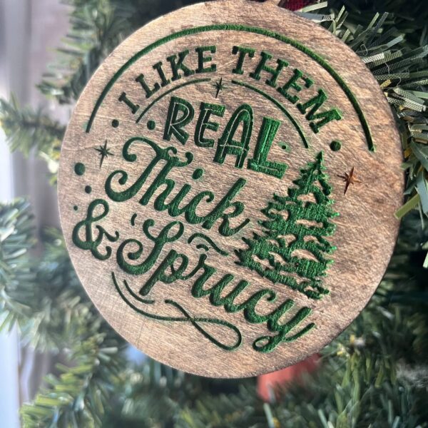 Shop Wyoming Funny Christmas Tree Ornament – “I Like Them Real Thick & Sprucy” – 3.25” Round Rustic Wood Holiday Decor – Hilarious Gag Gift for Tree Lovers