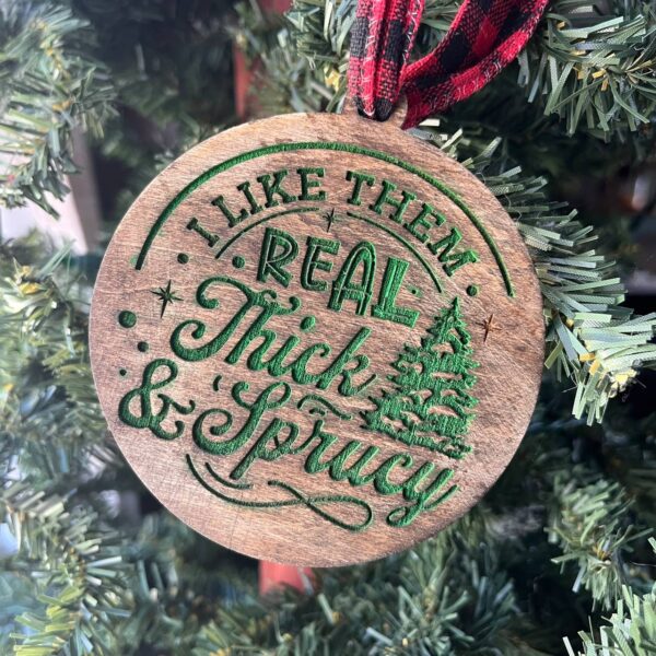 Shop Wyoming Funny Christmas Tree Ornament – “I Like Them Real Thick & Sprucy” – 3.25” Round Rustic Wood Holiday Decor – Hilarious Gag Gift for Tree Lovers