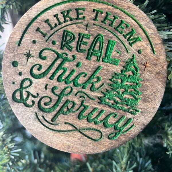 Shop Wyoming Funny Christmas Tree Ornament – “I Like Them Real Thick & Sprucy” – 3.25” Round Rustic Wood Holiday Decor – Hilarious Gag Gift for Tree Lovers