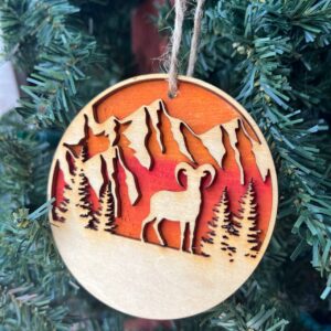 Shop Wyoming Mountain Goat Ornament – Bighorn Sheep Wooden Christmas Ornament – Nature-Inspired Outdoor Holiday Decor – Layered Sunset Forest Ornament 3.25″