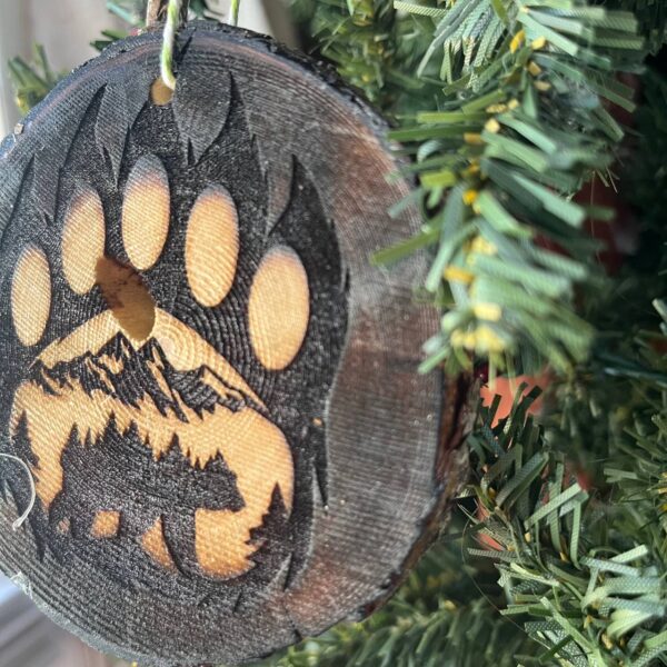 Shop Wyoming Bear Paw Print Engraved Pine Wood Ornament – Rustic Wildlife Tree Slice Décor – Locally Sourced 3.25″-4″ Round Ornament for Nature Lovers