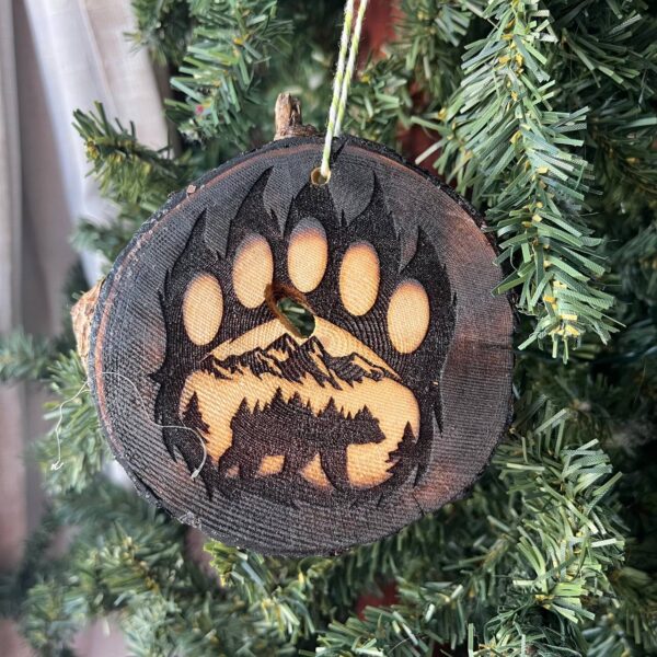 Shop Wyoming Bear Paw Print Engraved Pine Wood Ornament – Rustic Wildlife Tree Slice Décor – Locally Sourced 3.25″-4″ Round Ornament for Nature Lovers