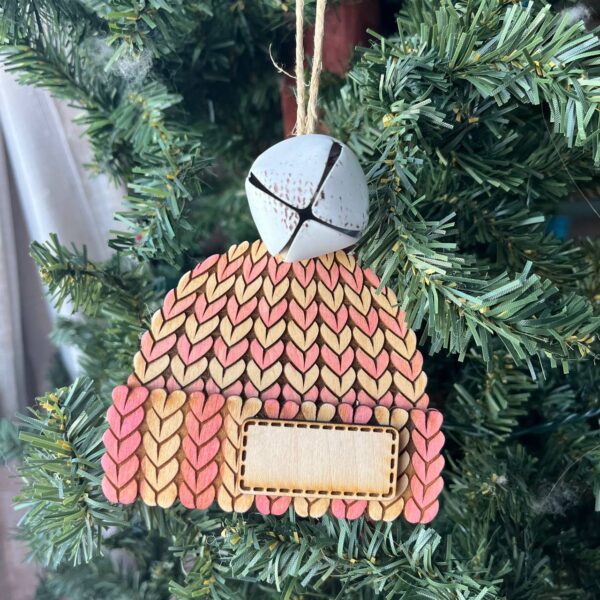 Shop Wyoming Personalized Knit Hat Christmas Ornament with Bell – Pink & Yellow Wood Beanie Tree Decor – Custom Winter Ornament for Kids, Family, Baby’s First Christmas – 4″ Tall