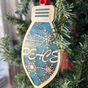 Shop Wyoming Peace Christmas Ornament – Blue Resin & Wood Light Bulb Tree Decoration | Rustic Holiday Ornament with Snowflakes | Winter Peaceful Decor