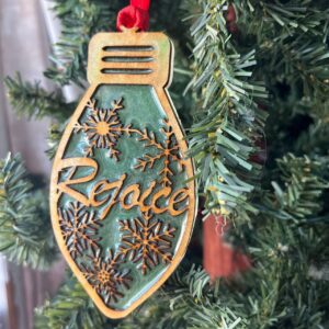 Shop Wyoming Rejoice Christmas Ornament – Green Resin & Wood Light Bulb Holiday Tree Decoration | Laser Cut Rustic Snowflake Ornament | Inspirational Holiday Decor