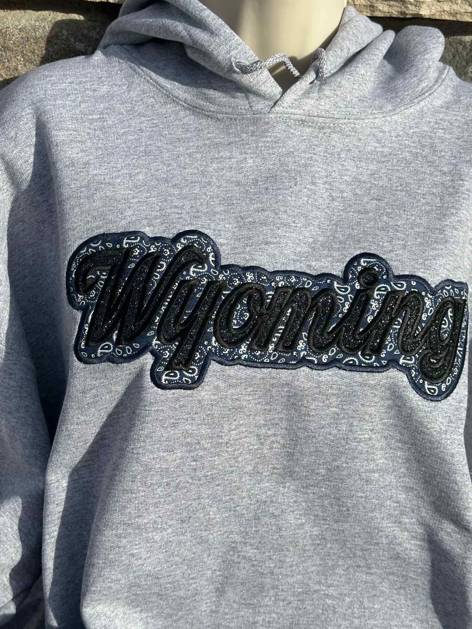Shop Wyoming Wyoming black sparkles with blue western applique Embroidery Hoodie Shop Wyoming Wyoming black sparkles with blue western applique Embroidery Hoodie