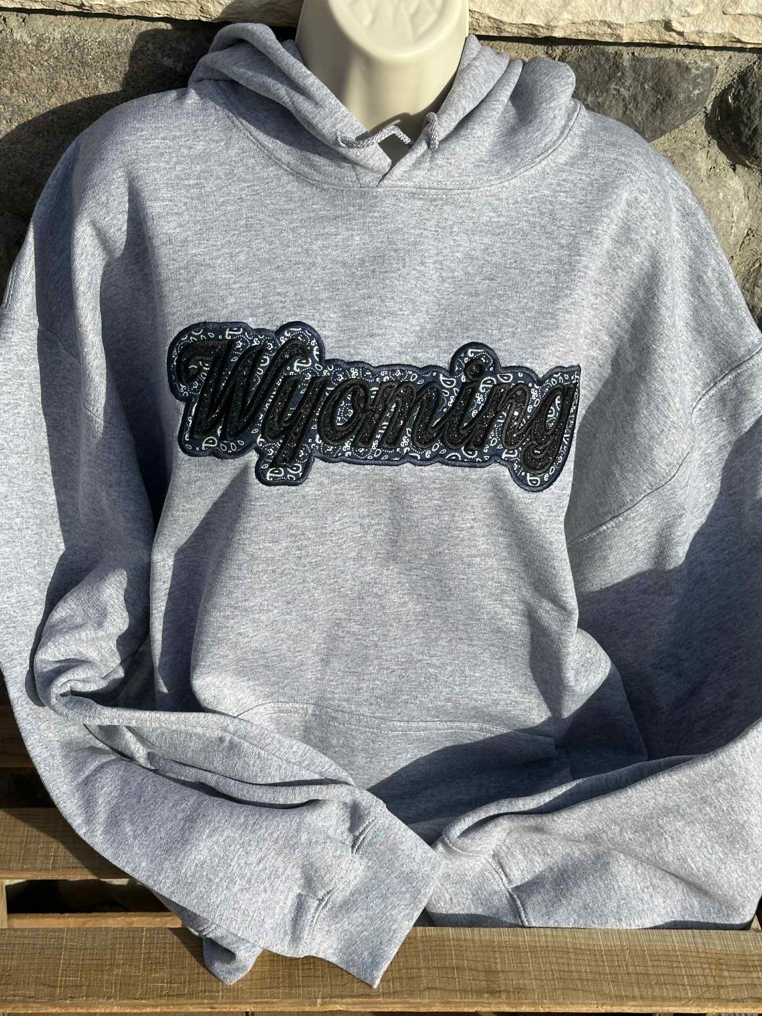 Shop Wyoming Wyoming black sparkles with blue western applique Embroidery Hoodie Shop Wyoming Wyoming black sparkles with blue western applique Embroidery Hoodie