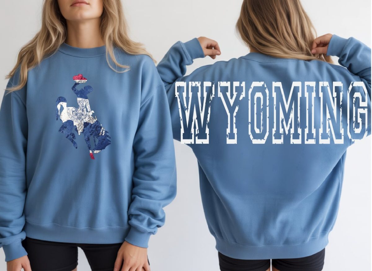 Shop Wyoming WYOMING varsity Red, white, and blue Crewneck Shop Wyoming WYOMING varsity Red, white, and blue Crewneck